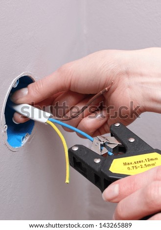 Electrician insulating electric wires of an electric box