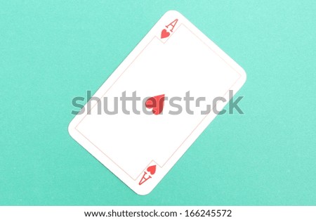 Closeup of game card - ace isolated on green background