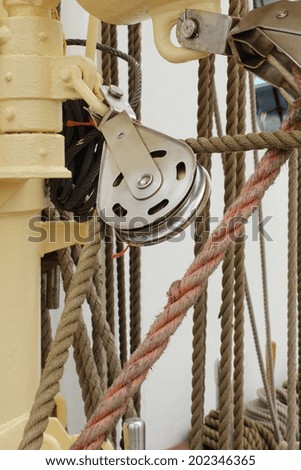Closeup of old metal block and rigging at the yacht