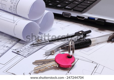 Electrical diagrams, construction drawings of house, accessories for drawing and laptop, concept of building house