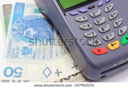 Payment terminal with money on white background, credit card reader, payment terminal with cash, finance concept