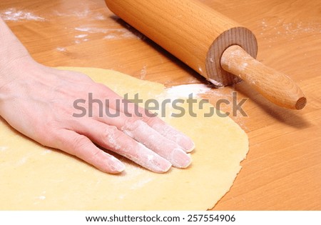 Hand of woman preparing dough for yeast cake, preparing yeast cake