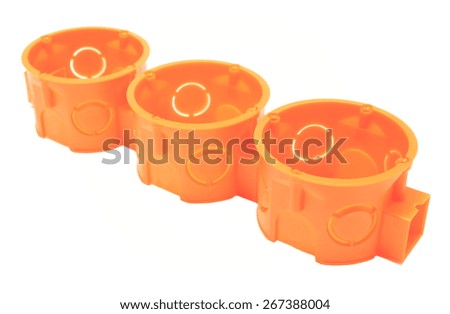 Orange plastic electrical boxes on white background, junction boxes, accessories for engineering jobs