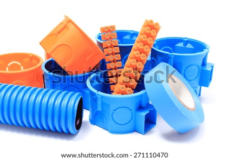 Orange and blue electrical boxes with components for use in electrical installations, accessories for engineering jobs