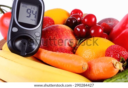 Glucometer with fresh ripe fruits and vegetables, concept of diabetes, healthy food, nutrition and strengthening immunity. Isolated on white background