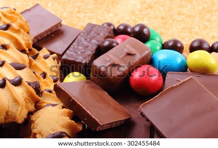 A lot of candies and cookies with brown cane sugar, too many sweets, unhealthy food, reduction of eating sweets