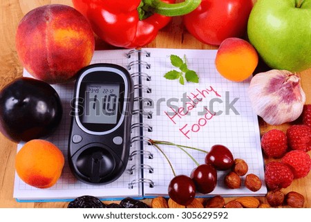 Fresh fruits, vegetables and glucose meter on notebook for writing notes, concept of healthy nutrition, diet and diabetes, sugar level