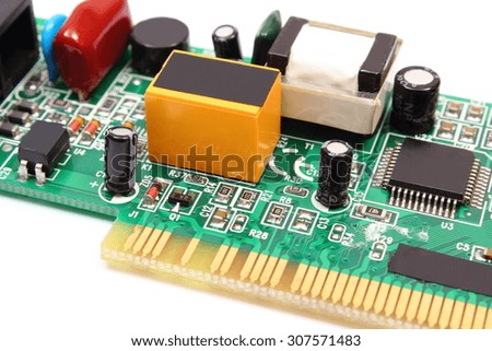 Printed circuit board with electrical components lying on white background, technology