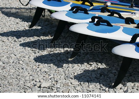 beach black blue board contest equipment fun grey ocean people rider sea stuff sun surf wave wind