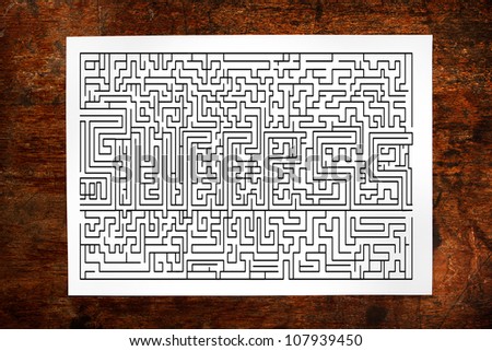 Channel maze game on wood background