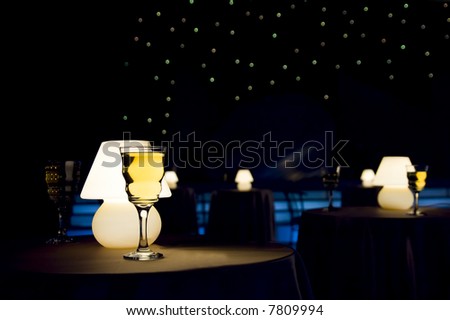 Romantic evening in restaurant with white wine and lamp