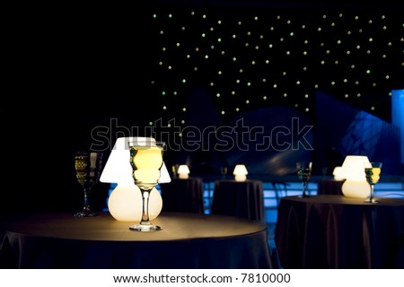 Romantic evening in restaurant with white wine and lamp