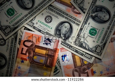 Euros and Dollars - International paper money close up - money background