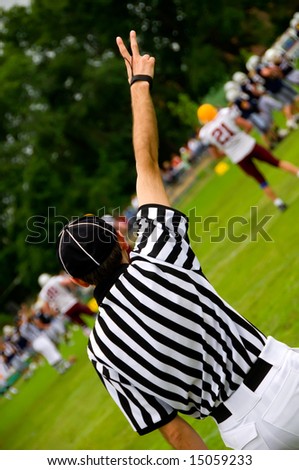 American football referee with hands up - Judge concept
