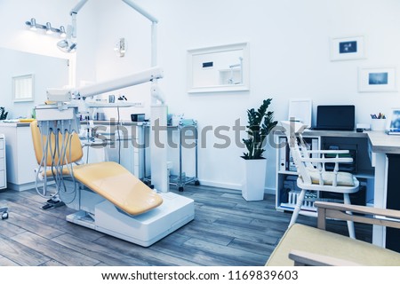 Special equipment for a dentist. Modern dentist\'s chair in a medical room.