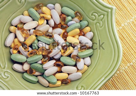 Vitamin Soup: Close-up of assorted nutritional supplements served in a decorative bowl.