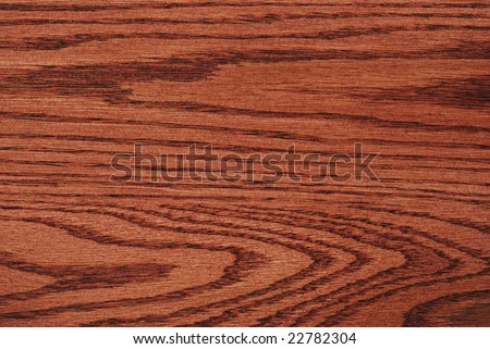 Natural wood grain design of oak wood with cherry stain finish.  Macro showing texture and details.