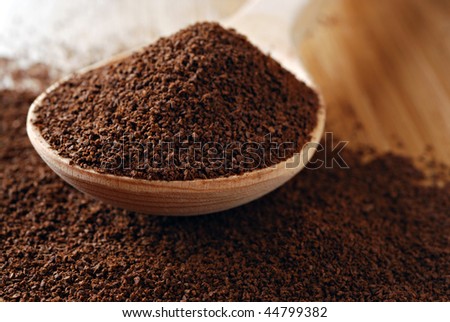 Fresh ground coffee with wooden spoon.  Macro with extremely shallow dof.