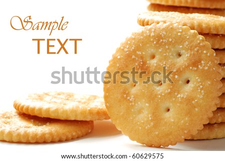 Round salty crackers on white background with copy space.  Macro with shallow dof.