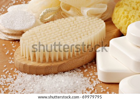 Spa still life with bamboo bath brush and natural vegetable oil soap.  Macro with shallow dof.