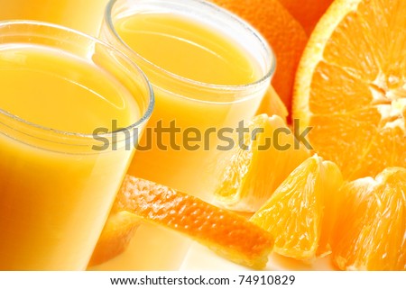 Freshly squeezed orange juice montage.