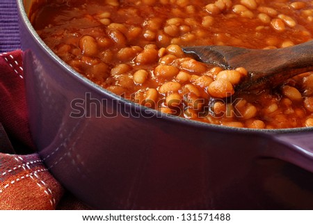 Bubbly hot baked beans (brown sugar recipe) right out of the oven.  Closeup with shallow dof.