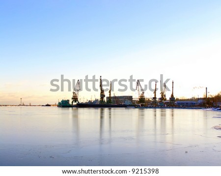 winter cargo side port with ships and cranes