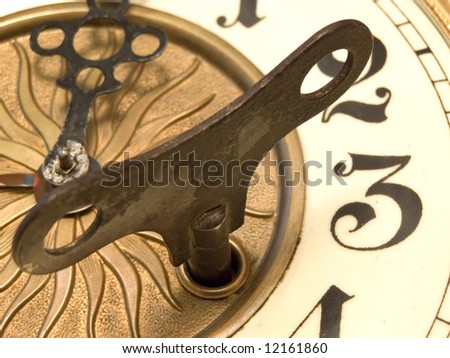 Old fashioned close up clock with the key