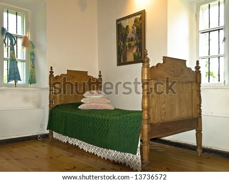 old oak bed in the corner of the room