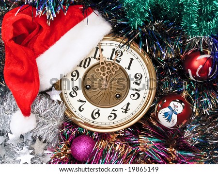 new year clock with red hat and garland