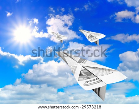 blue cloudy sky with sun and flying paper airplanes