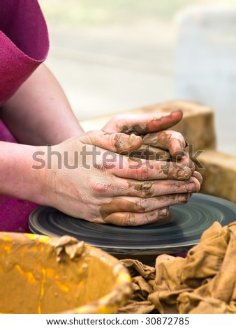 Photo of the potter worker hands at work