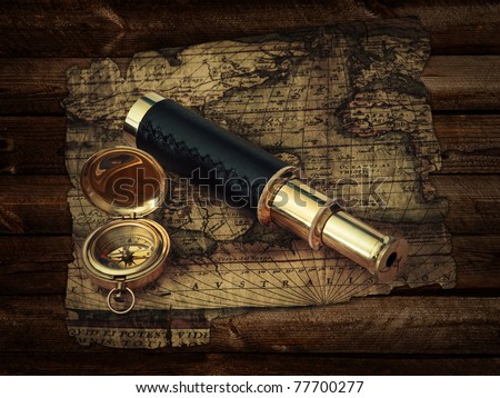 traveling theme: vintage telescope and compass at antique (17 century) map at wooden background