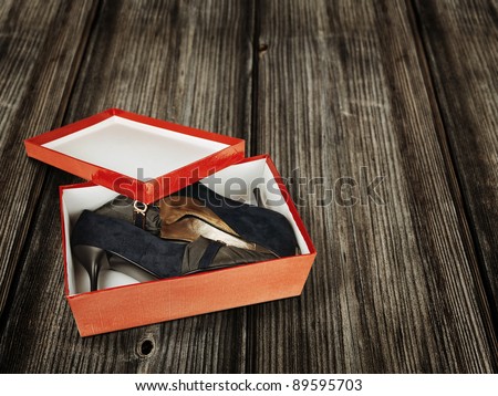 woman shoes in the red box on the floor