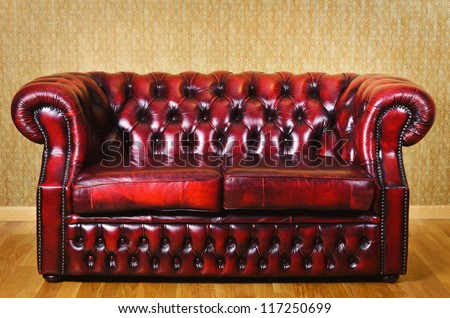 Red Genuine Leather Sofa Near The Wall