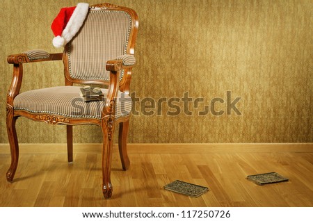 Old Antiques Armchair With Santa\'s Hat And Books