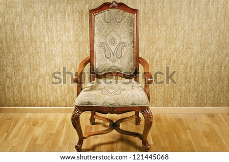 Single Old Antique Chair Near The Wall