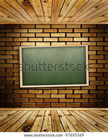 school blackboard at brick wall in interior with wooden floor