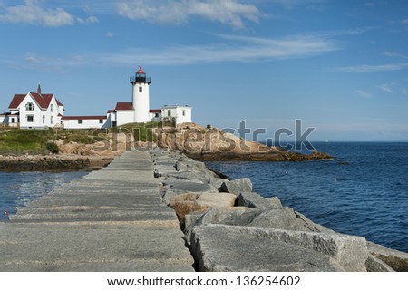Visitors can walk along the nearly mile long jetty to get a clear view of Eastern Point Lighthouse in Gloucester, Massachusetts.