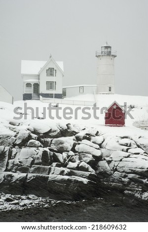 Cape Neddick (Nubble) lighthouse in Maine guides mariners year round, including snowstorms.