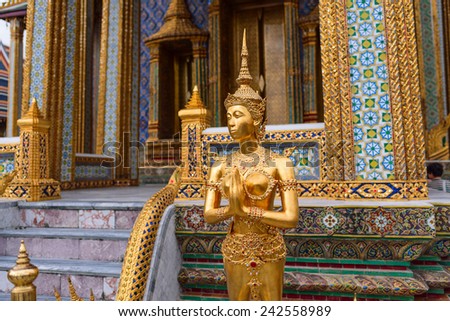 female golden thai guardian demon statue  at WAT PRAKEAW , Thailand
