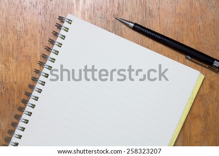 Notebook and pen on desk