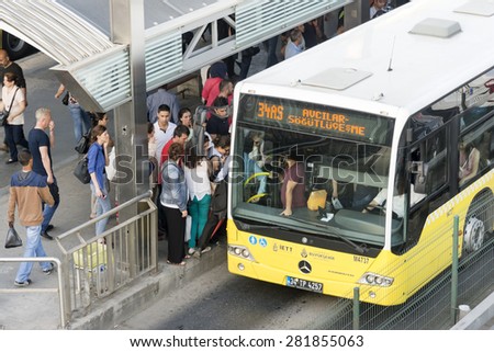 ISTANBUL, TURKEY, MAY 26, 2015: People trying to get on to Metrobus, a divided bus lane for public transportation between Istanbul\'s crowded districts.