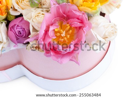 Flower bouquet in a heart shaped box isolated on white background