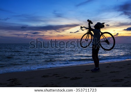 Silhouette of the man,drinking water with beautiful sea by at sunset