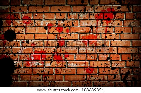 Red brick wall background with black and red stains