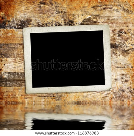 Blank photo frames on the grunge background