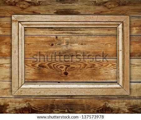 Vintage wooden frame on wood background