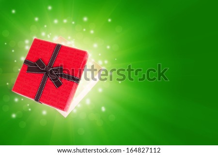 half open gift box with light inside out