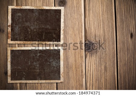 Vintage photo frames on wooden background
